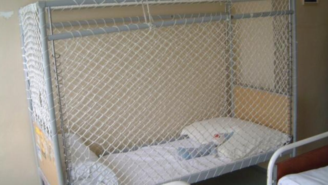 A netted cage bed. © MDAC and the League of Human Rights.