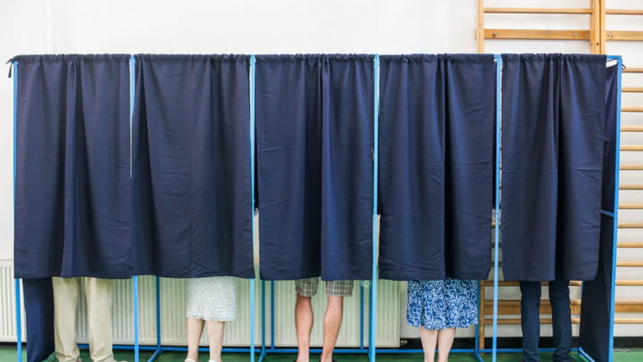 People in voting booth (c) Stock Photo